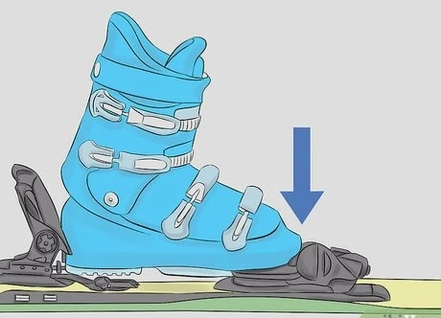 étape 2 placez une chaussure de ski dans la fixation de manière à ce que la pointe de la chaussure s'insère dans l'avant de la fixation.