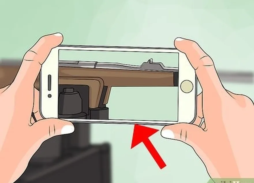 étape 3 photographier l'arme pour s'en servir comme guide.