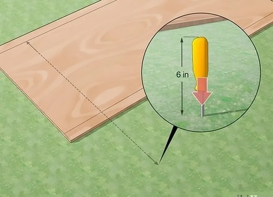 étape 4 : plantez un tournevis dans le sol au niveau de la mesure.