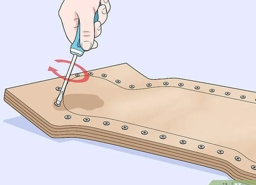 étape 8 introduisez une vis dans un trou situé près du nez de votre planche.