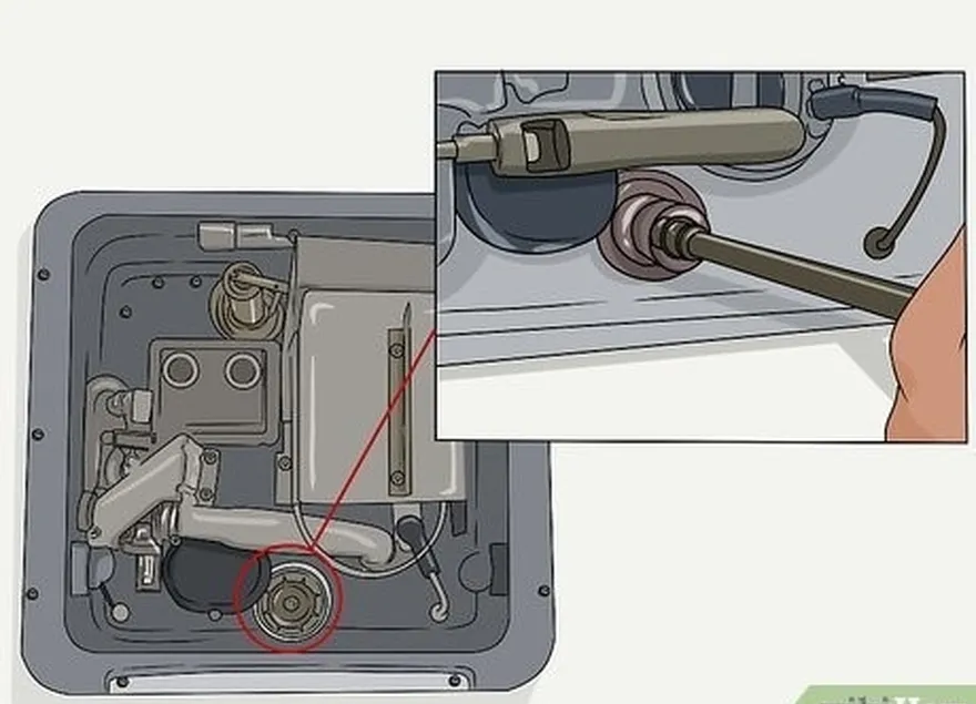 étape 4 dévisser le réservoir's plug or anode rod with a socket wrench.