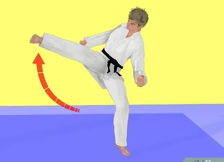 étape 1 utilisez le coup de pied latéral de kickboxing pour les exercices d'aérobic en kickboxing.