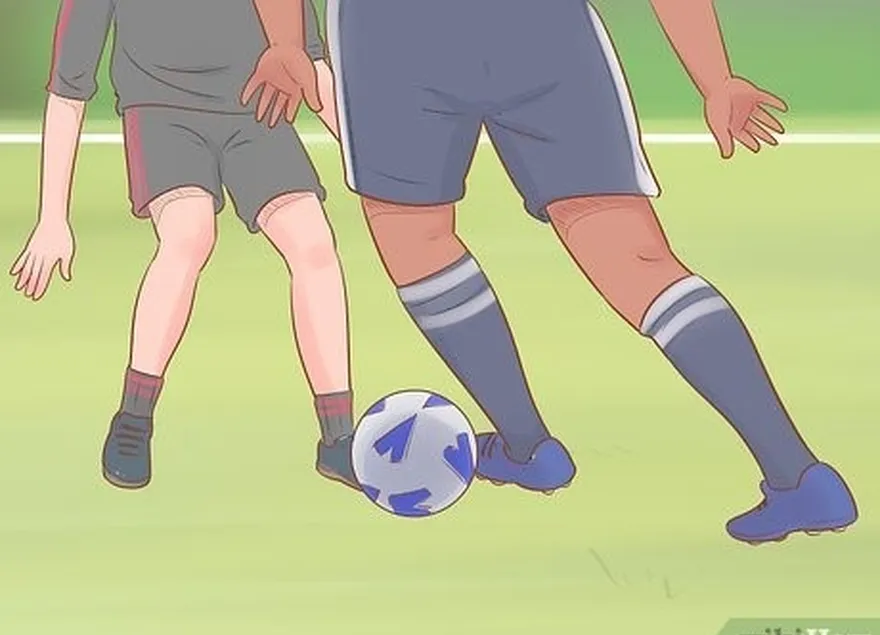 étape 3 dribbler avec les côtés de vos pieds lorsque vous vous approchez d'un défenseur.