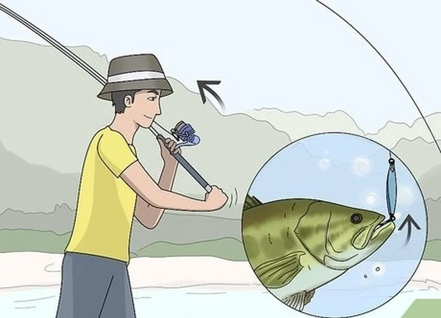 étape 4 relevez la canne en l'air pour placer l'hameçon dans la bouche du poisson.