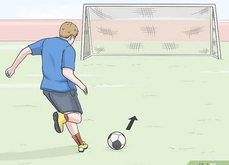 étape 4 pointer le pied qui ne frappe pas dans la direction où vous voulez que le ballon aille.