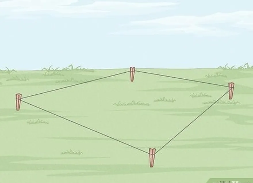 étape 3 attachez une longue ficelle autour des 4 piquets.