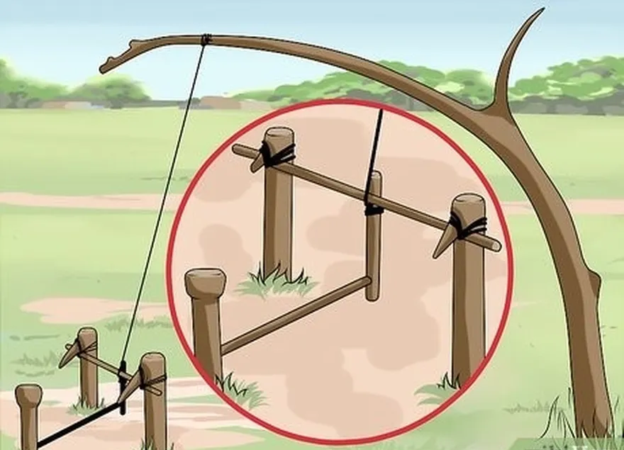 étape 6 placer un bâton entre la cheville et le petit bâton sur le fil de fer.