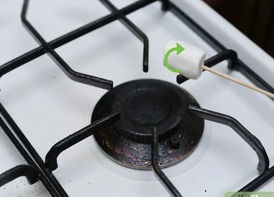 étape 2 faites griller les guimauves sur une cuisinière à gaz.