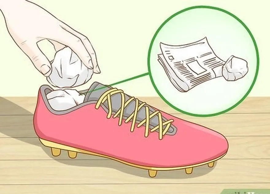 étape 4 rembourrez vos chaussures de football avec du papier journal pour personnaliser l'étirement.