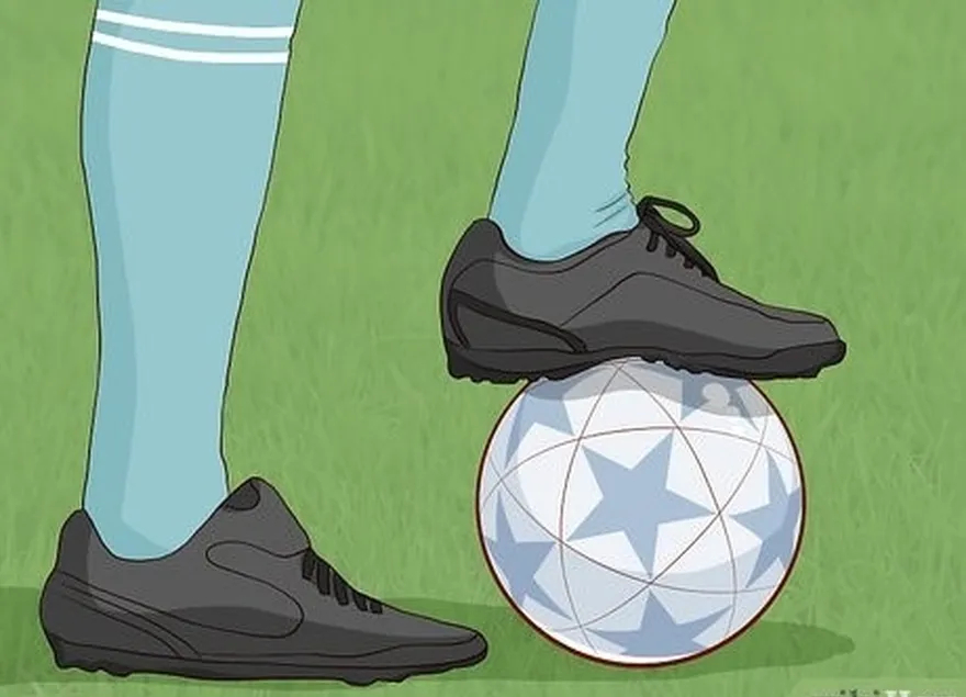 étape 2 mettez votre pied sur le ballon pour perfectionner le piège du pas.