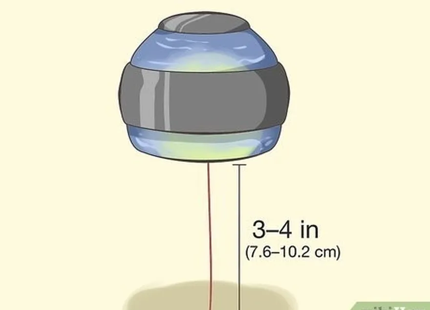 étape 6 arrêtez d'enrouler la boule lorsqu'il ne reste plus que 7,6 à 10,2 cm de corde.